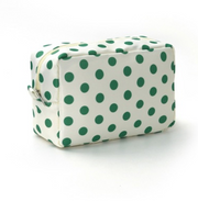 A rectangular zippered cosmetic bag with a white background and green polka dots, shown on a clean white studio background.
