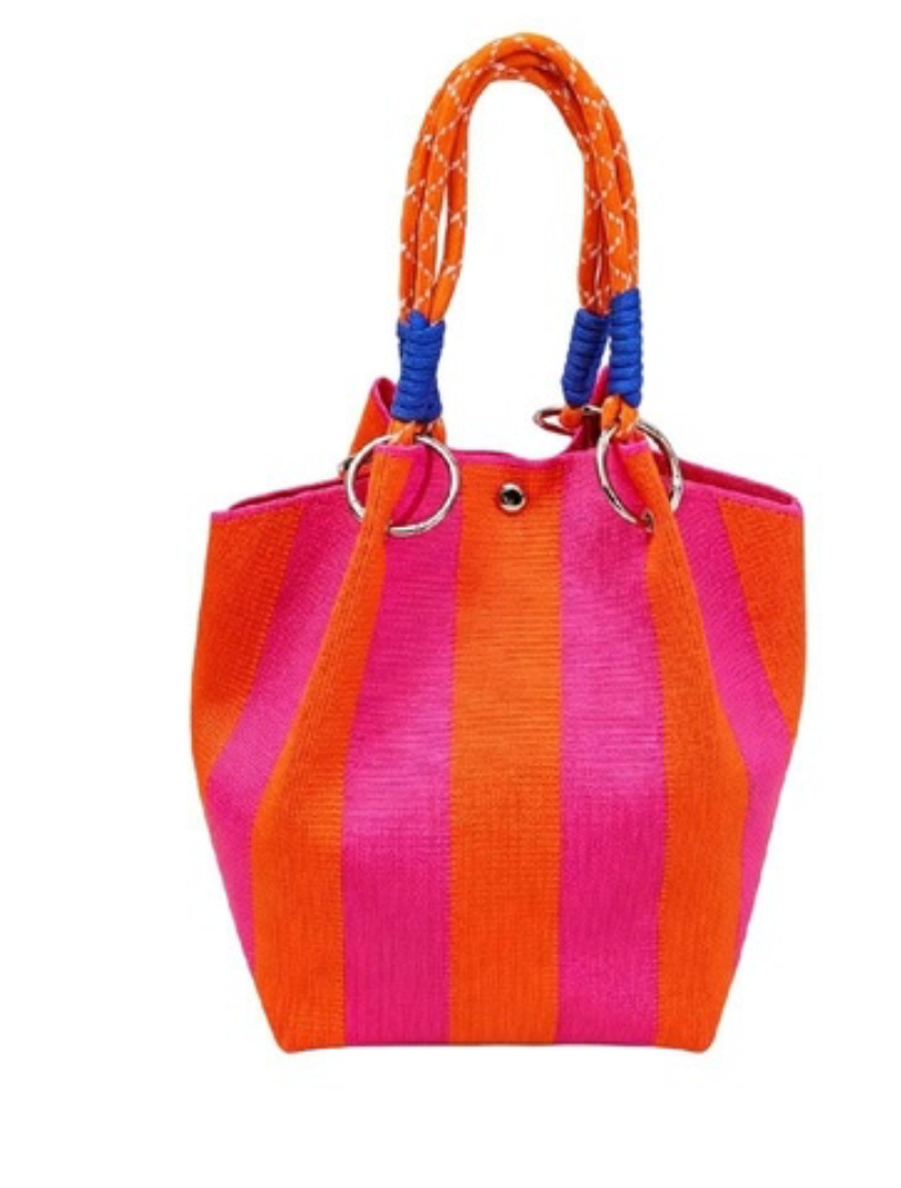 Diana knit bucket bag with fuchsia and orange vertical stripes, braided orange handles, blue accents, and silver-tone rings.