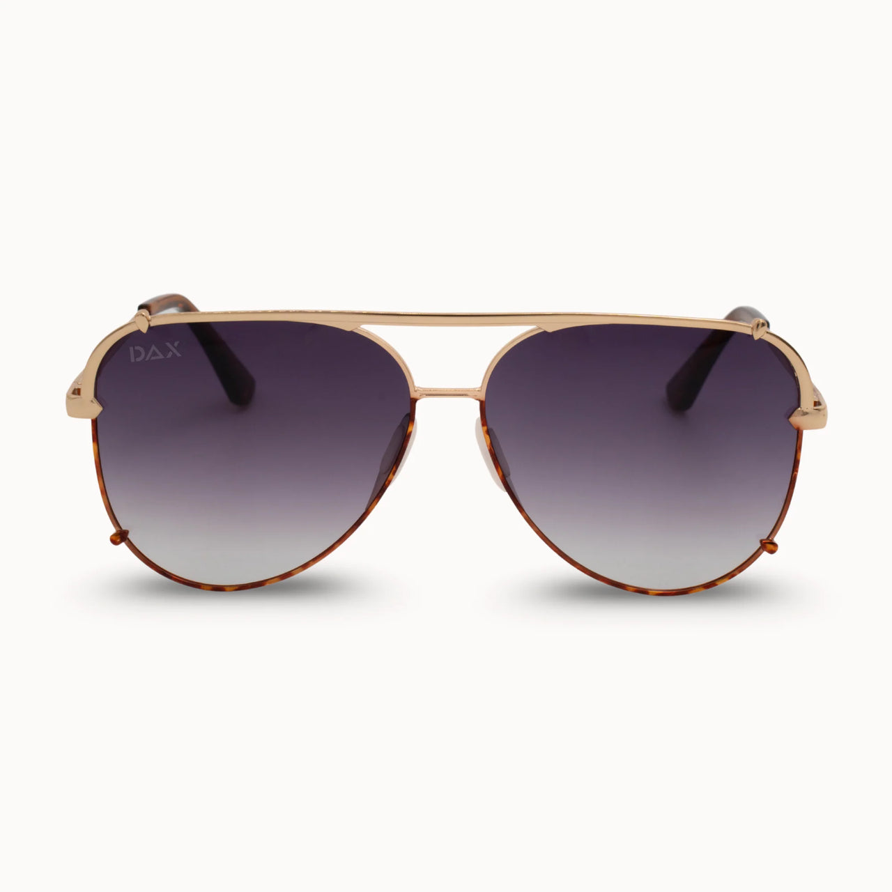 Aviator sunglasses with gold frame and dark gradient lenses on a white background