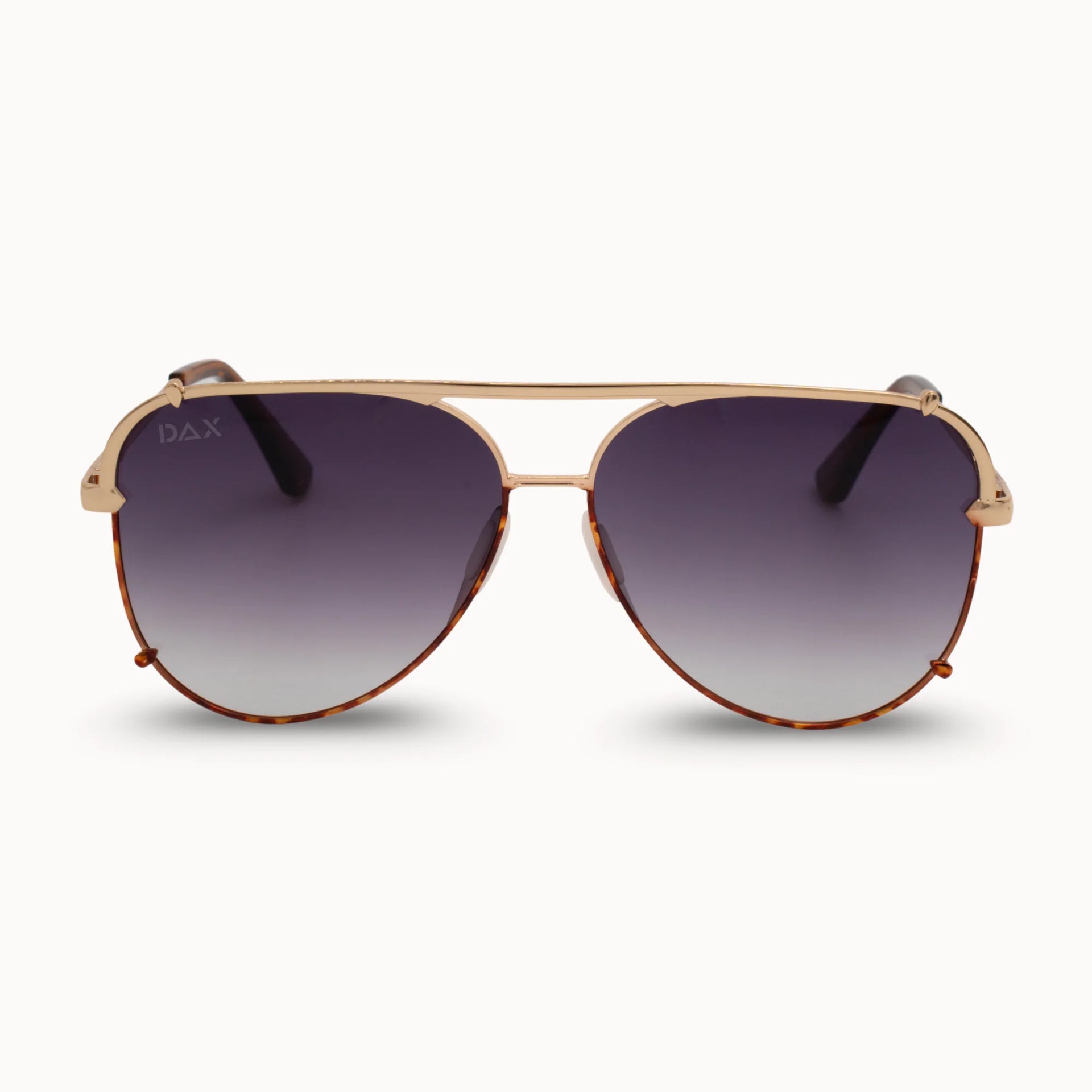 Aviator sunglasses with gold frame and dark gradient lenses on a white background