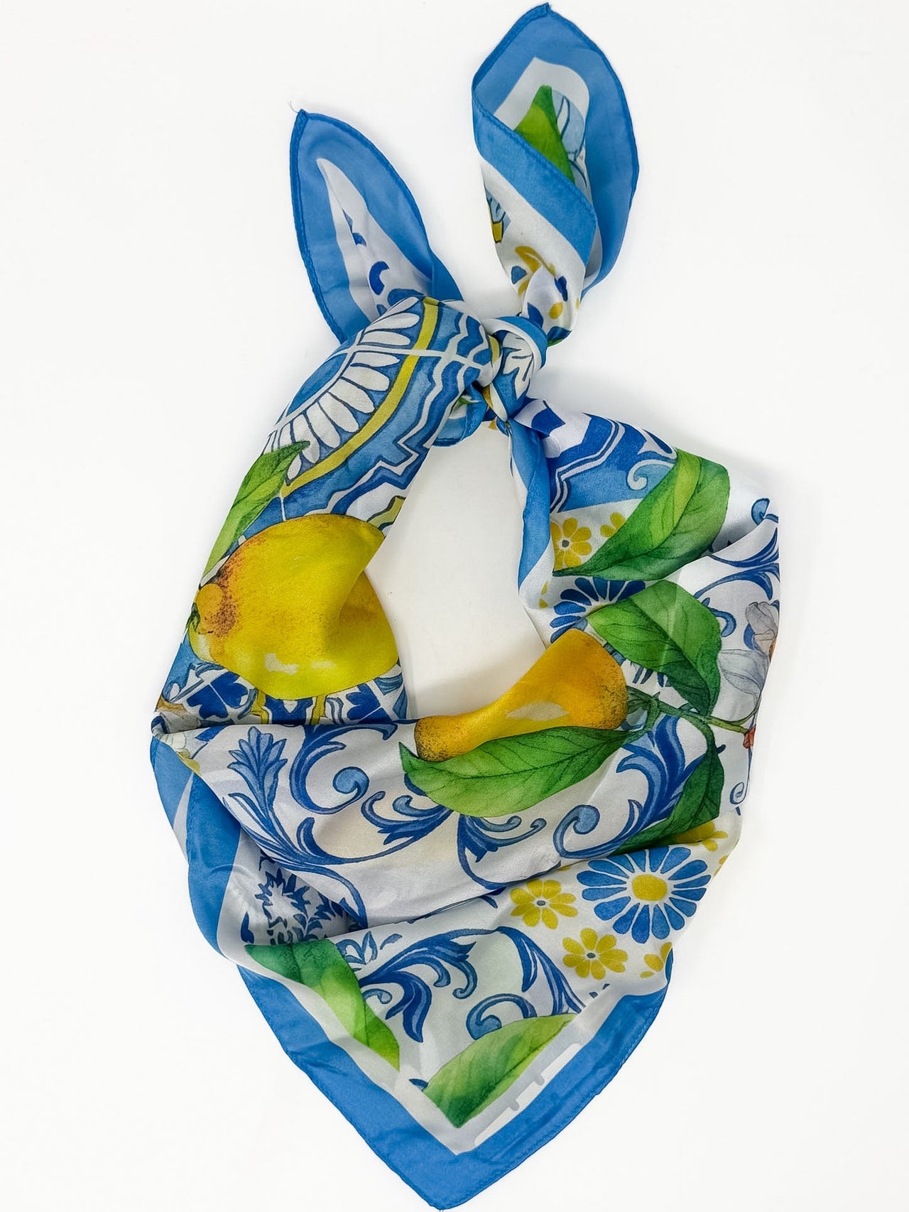 Decorative headband with floral and lemon pattern on a white background