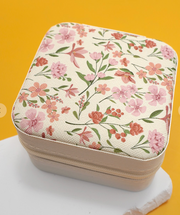 Floral-patterned fabric box with a zipper on a yellow background
