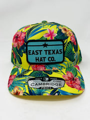 Colorful floral-patterned cap with 'East Texas Hat Co.' branding on a white background