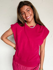 woman wearing a pink short sleeve and short matching outfit 