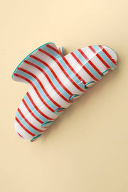 Striped balloon shaped like a caterpillar on a beige background