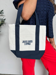 Person holding a tote bag with 'Jesus Saves I Spend' text against a white background