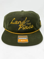 Green cap with 'Land of the Pines' text on a white background