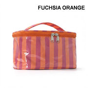 A striped cosmetic bag in fuchsia orange and pink with a clear front panel and top handle, shown on a white background with the text 'FUCHSIA ORANGE' above it.
