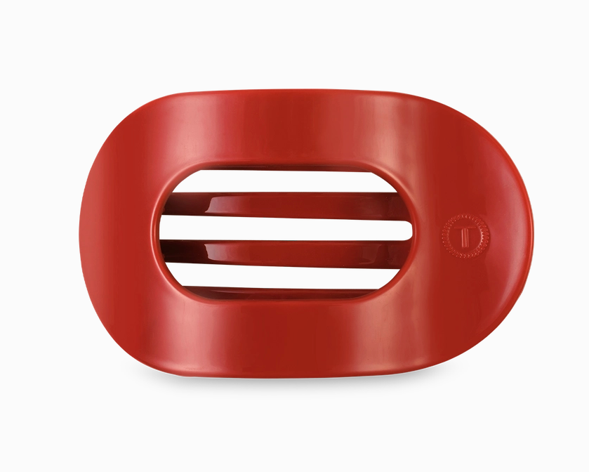 Red hair clip from teleties on a white background