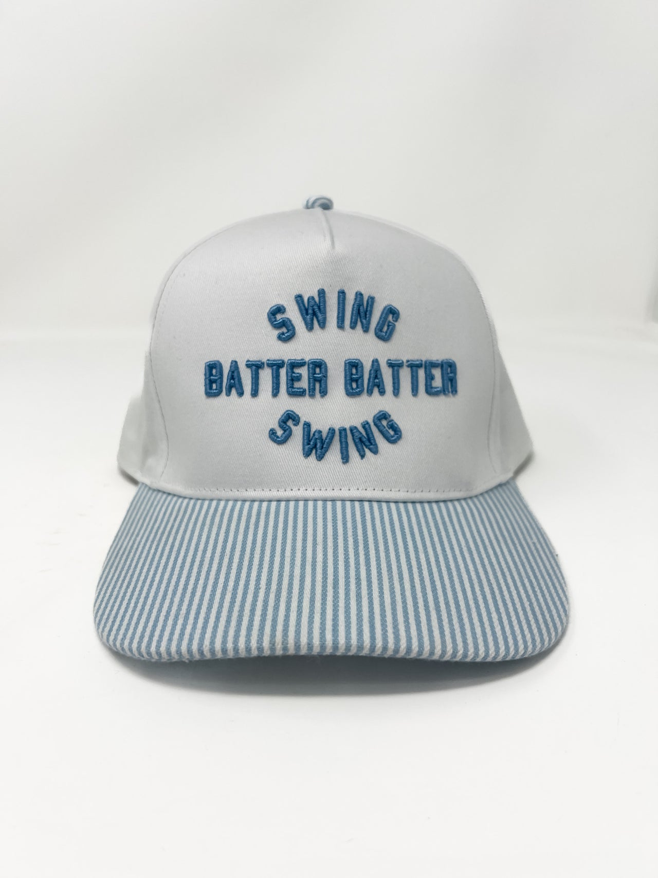 Gray cap with blue text 'SWING BATTER BATTER SWING' on a white background