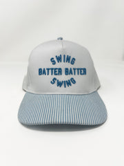 Gray cap with blue text 'SWING BATTER BATTER SWING' on a white background