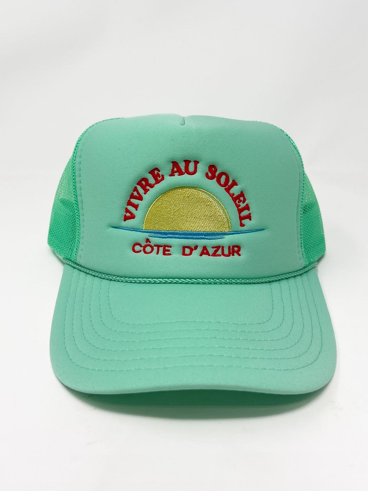 Green cap with 'Vivre au Soleil Cète d'Azur' text and sun graphic on a white background