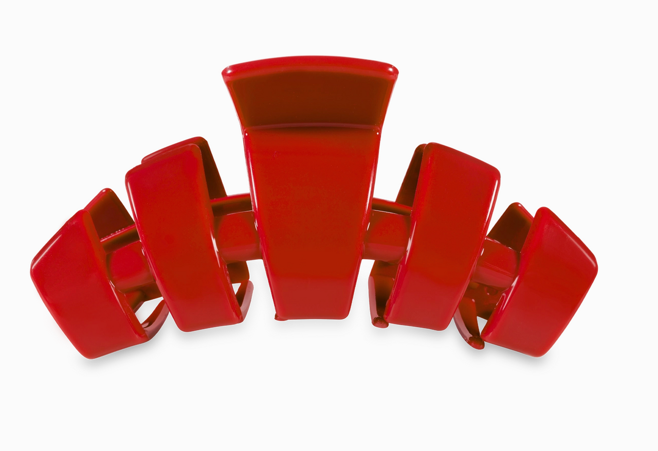 Red hair clip on a white background