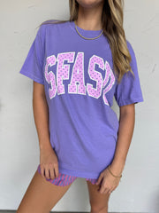 Person wearing a purple t-shirt with 'SFASU' printed on it against a white background