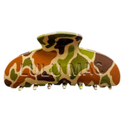 A large claw hair clip featuring a glossy camouflage pattern in green, brown, tan, and black, with the brand name 'LULU MAC' embossed on the front, set against a plain white background.