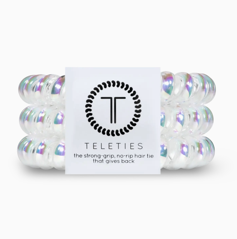 Iridescent hair ties with a Teleties branded card on a white background
