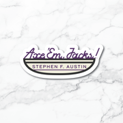 A die-cut vinyl sticker featuring the text 'Ace 'Em, Jacks!' in purple script and 'STEPHEN F. AUSTIN' in purple block letters on a cream banner, outlined in black and white, shown on a white marble background.