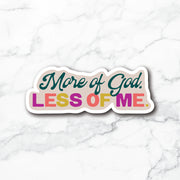A die-cut sticker with the text 'More of God. LESS OF ME.