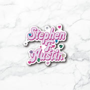 A die-cut vinyl sticker with the text 'Stephen F. Austin' in pink cursive lettering, embellished with small colorful heart gems and rhinestones, shown on a white marble background.
