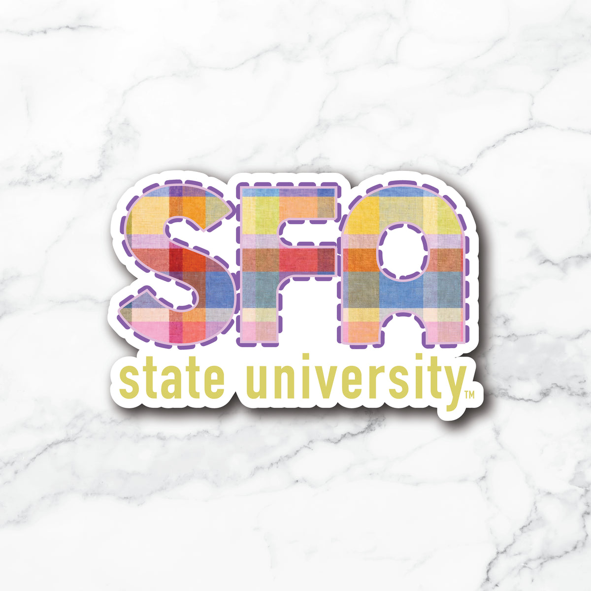 A die-cut sticker featuring the letters 'SFA' filled with a colorful patchwork pattern and the words 'state university' below in yellow, shown on a white marble background.
